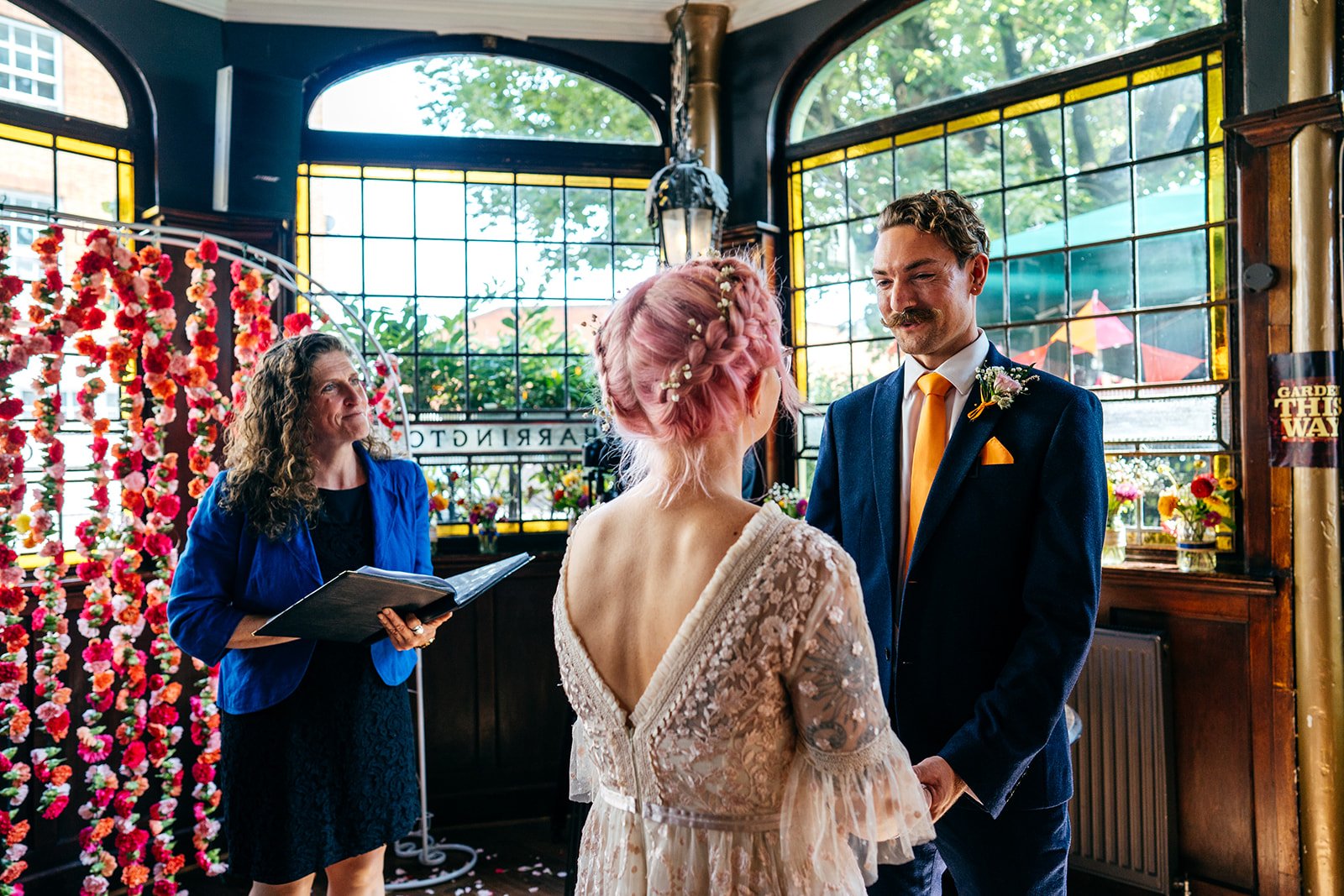 Groom and bride taking vows in London Pub Wedding