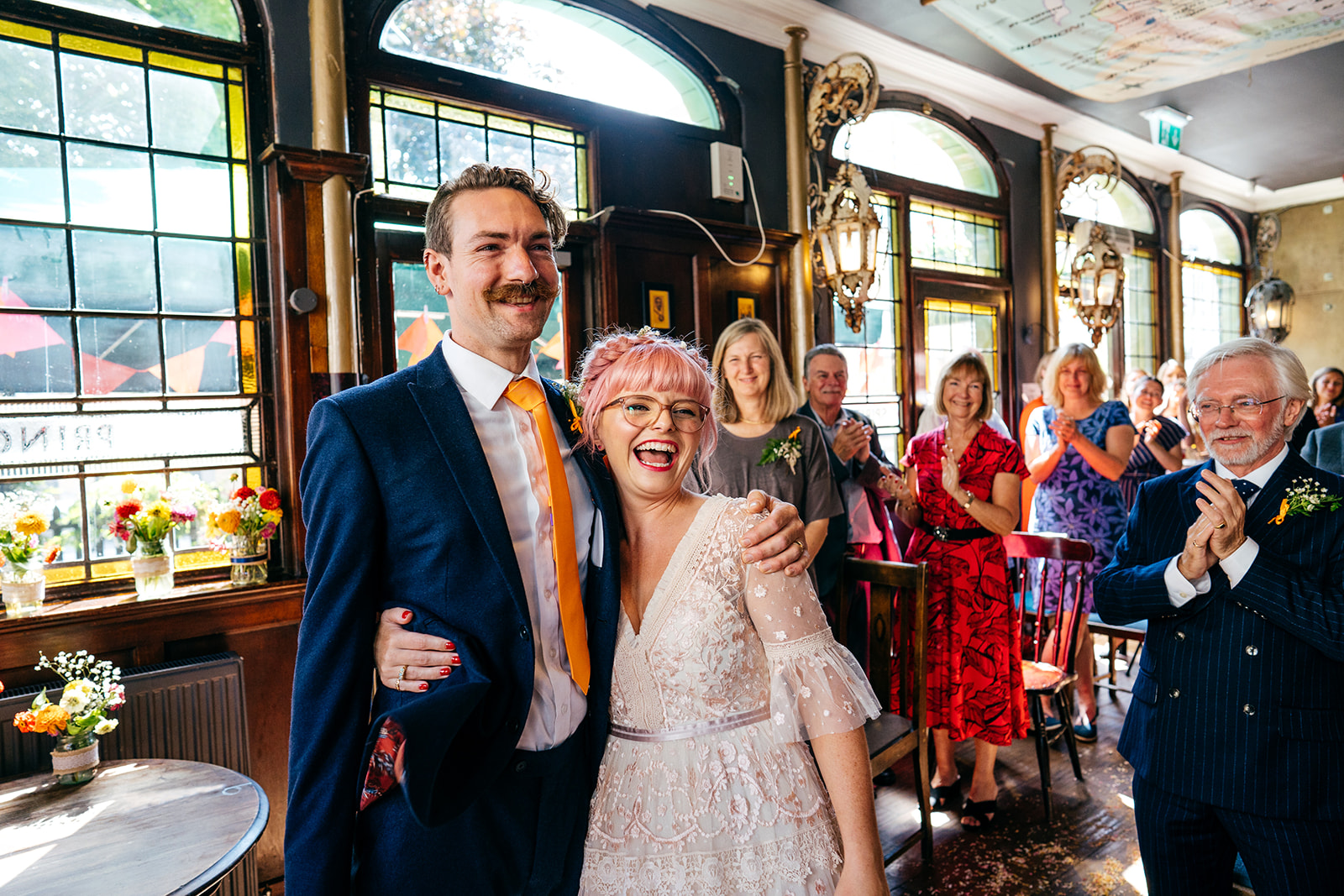 Colourful London Pub Wedding Photography. Couple llooking really happy after ceremony ends/ 