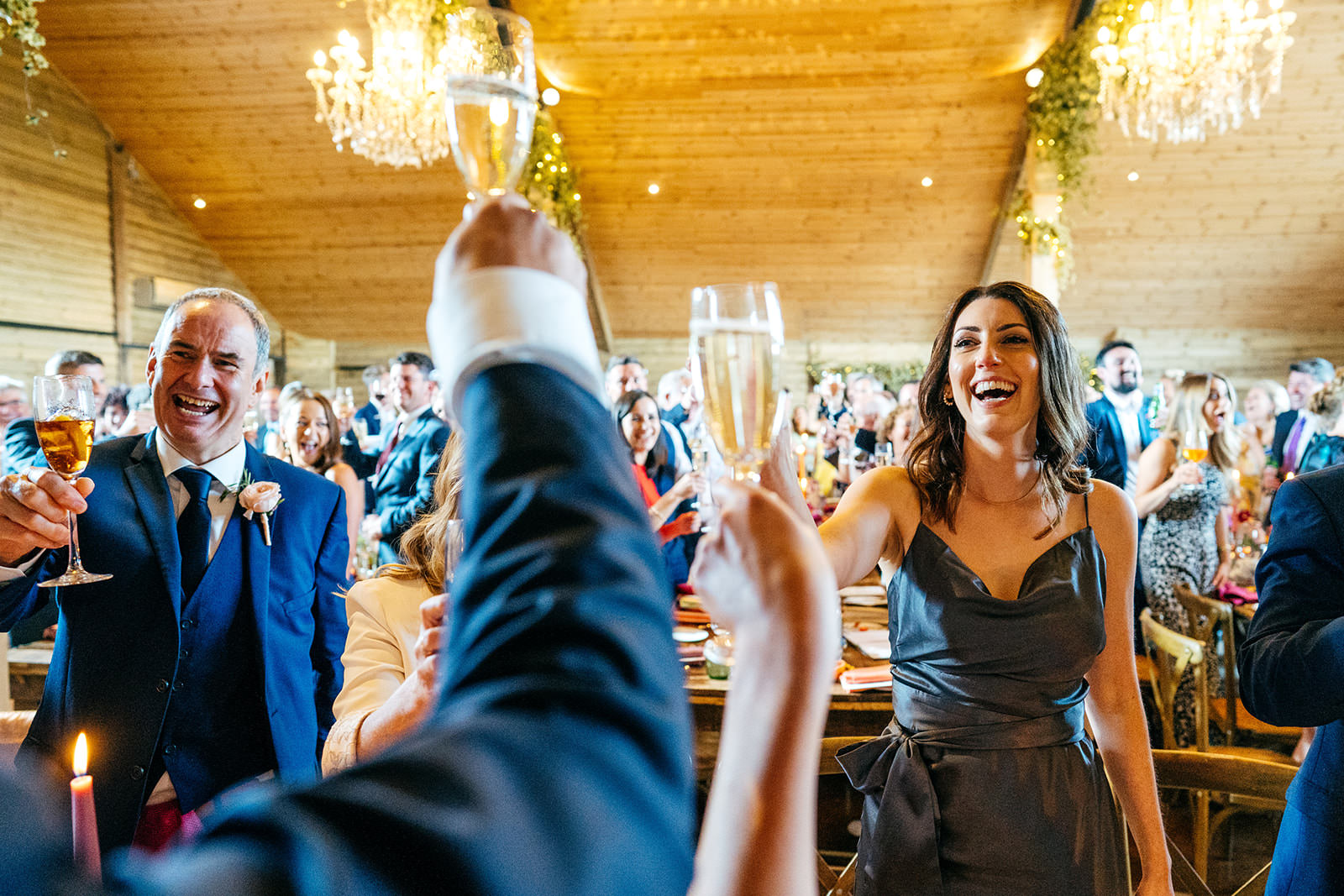 Guests make a toast during wedding speech at High Billinghurst Farm