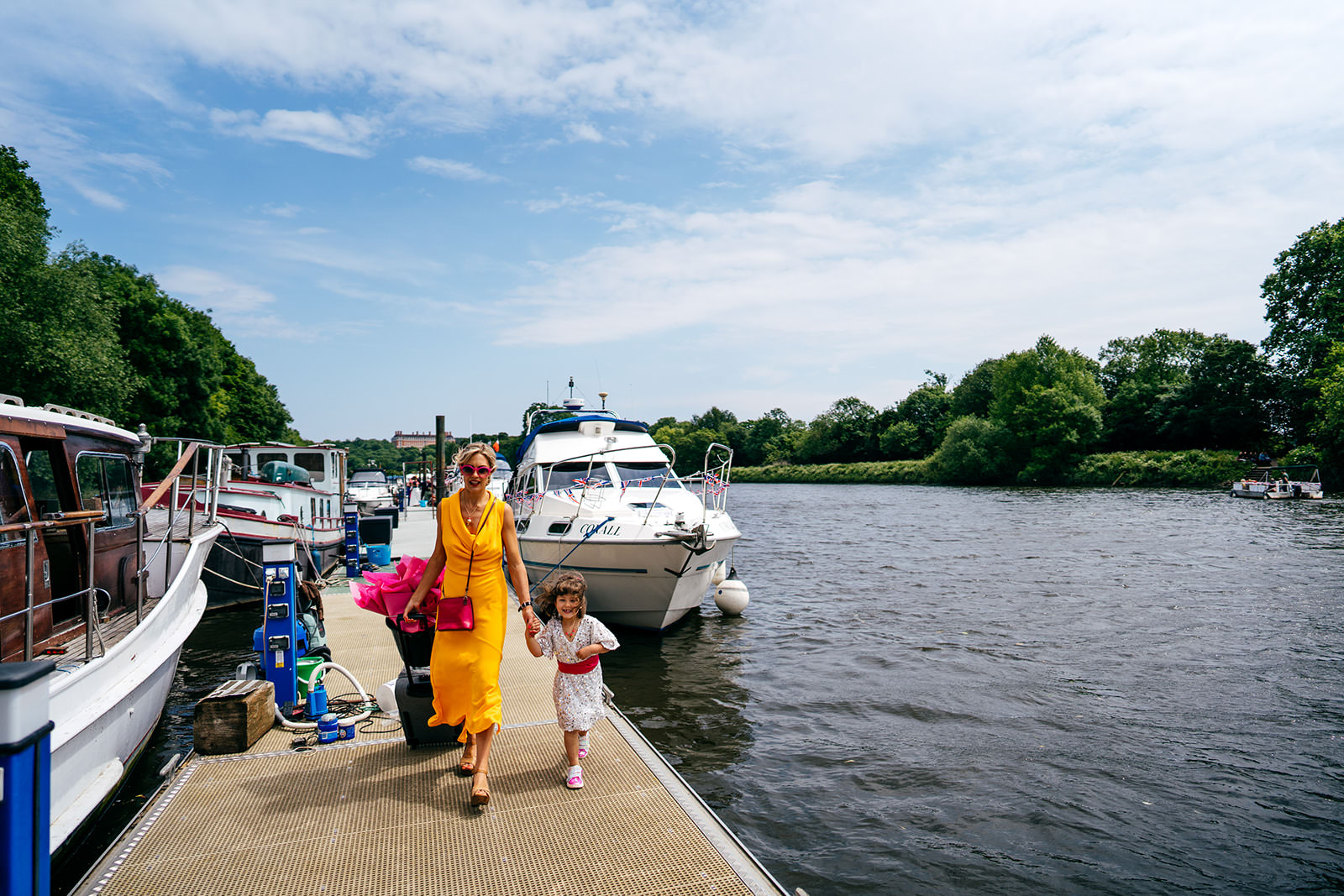 Bridal party disembark boat on River Thames and head on foot to Secret River Garden Wedding