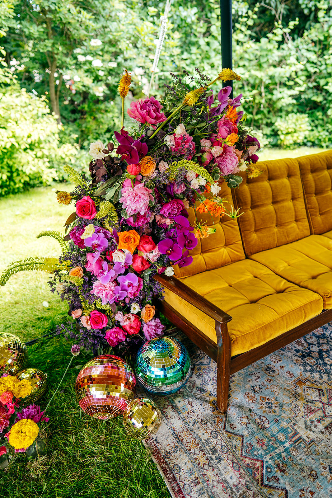 Gorgeous retro velvet sofa details and flowers by brilliant florists called Filth from London