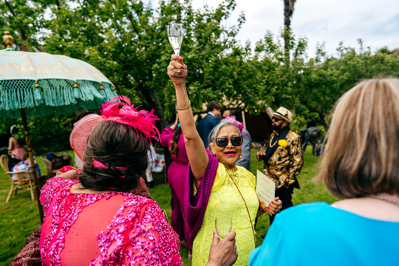Auntie was the life and soul of this party in her neon yellow dress raising her champagne aloft