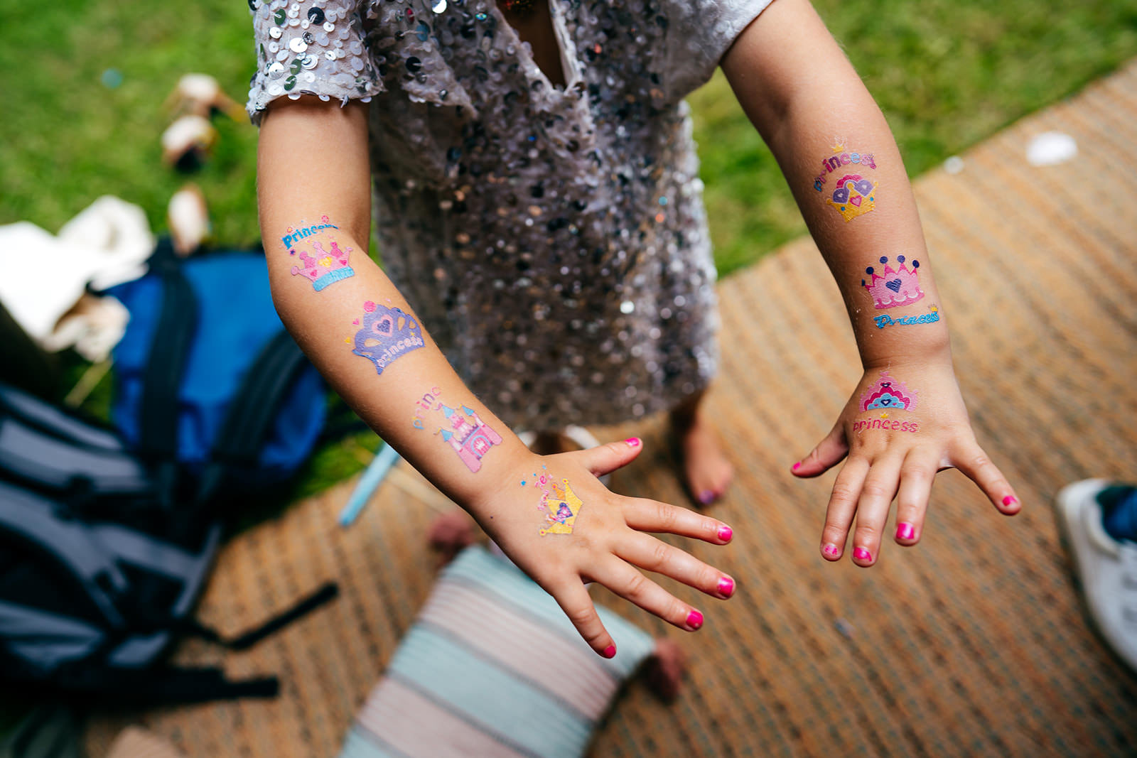Little girl shows off her festival style glitter tattoos 