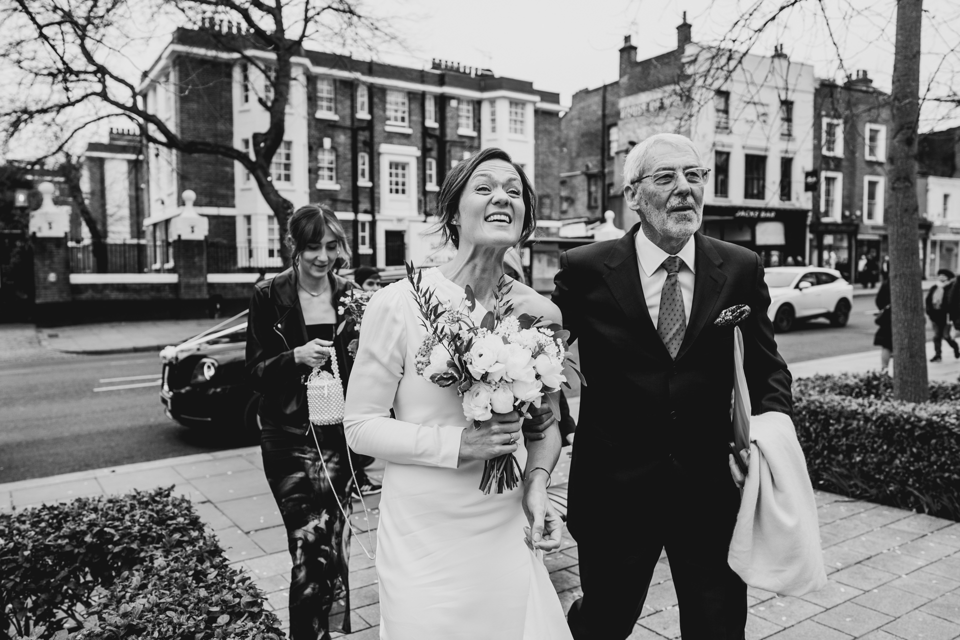 Bride and family arrive at ceremony at Islington Town Hall via Black Cab