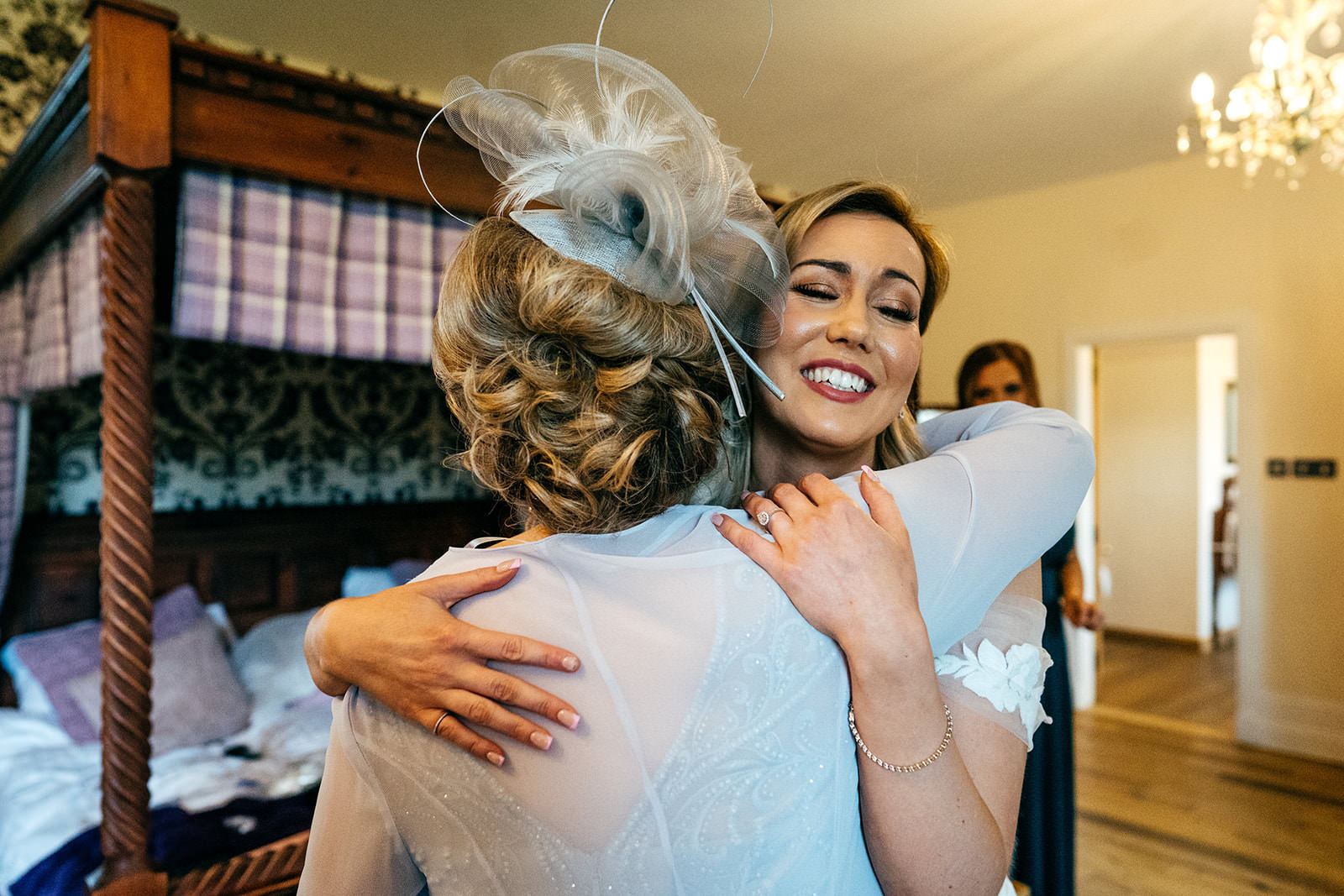 Bride hugs her mum during wedding prep