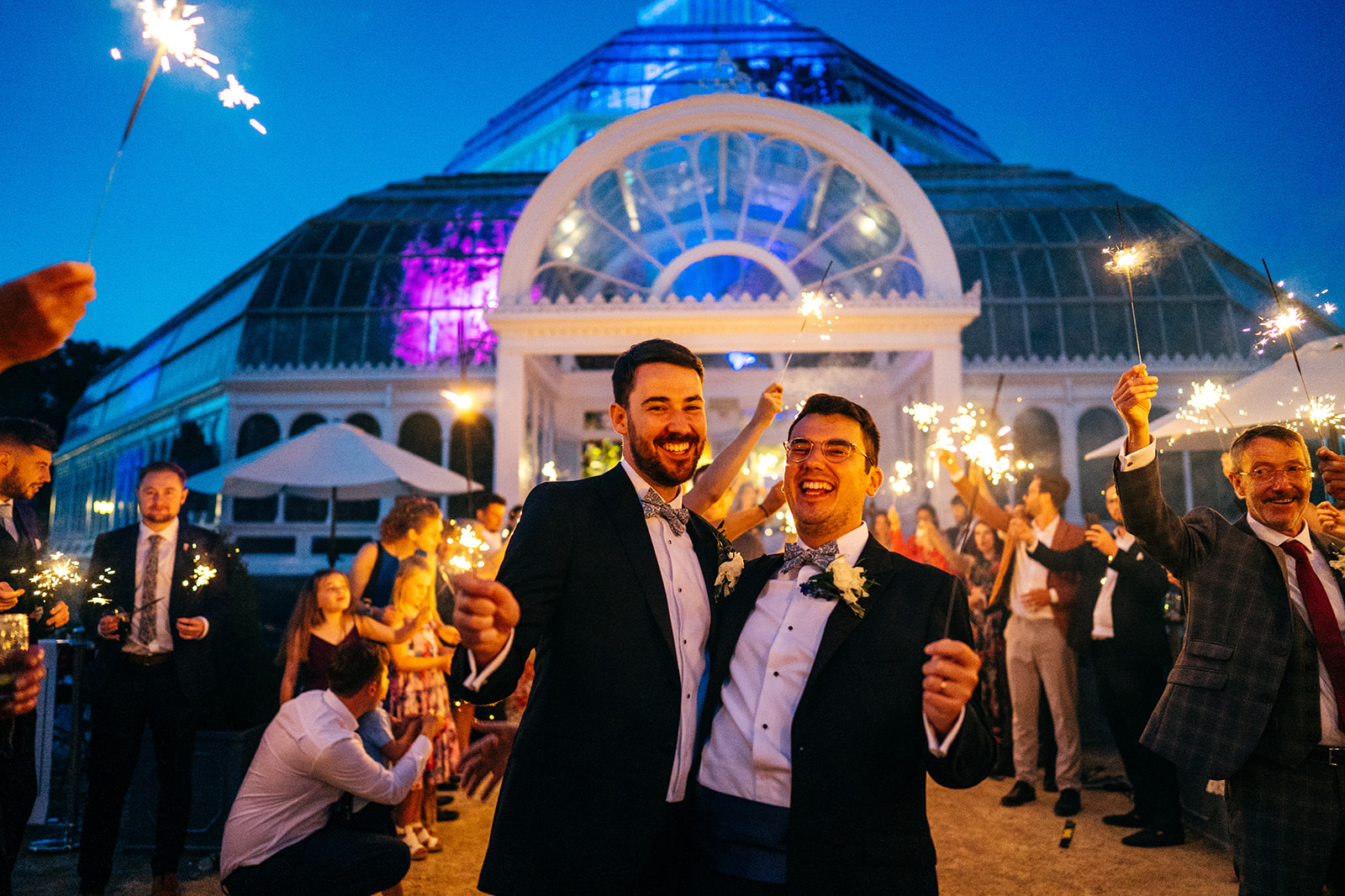Sparkler exit at Sefton Park Palm House Wedding fro Phil and Pete in their tuxedos