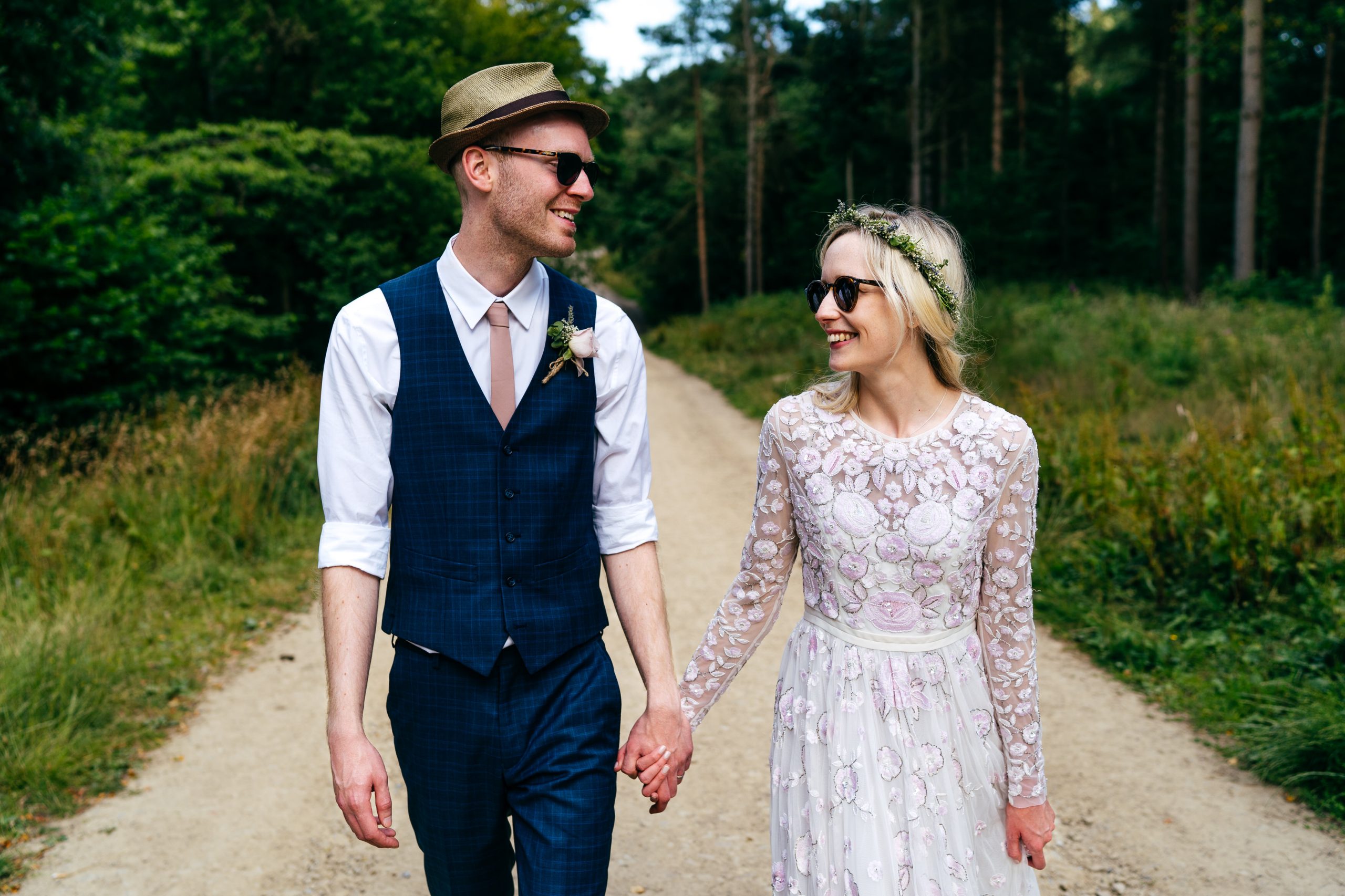 Relaxed couple shoot on their wedding day in woodland opposite the venue at Chilli Barn Otley