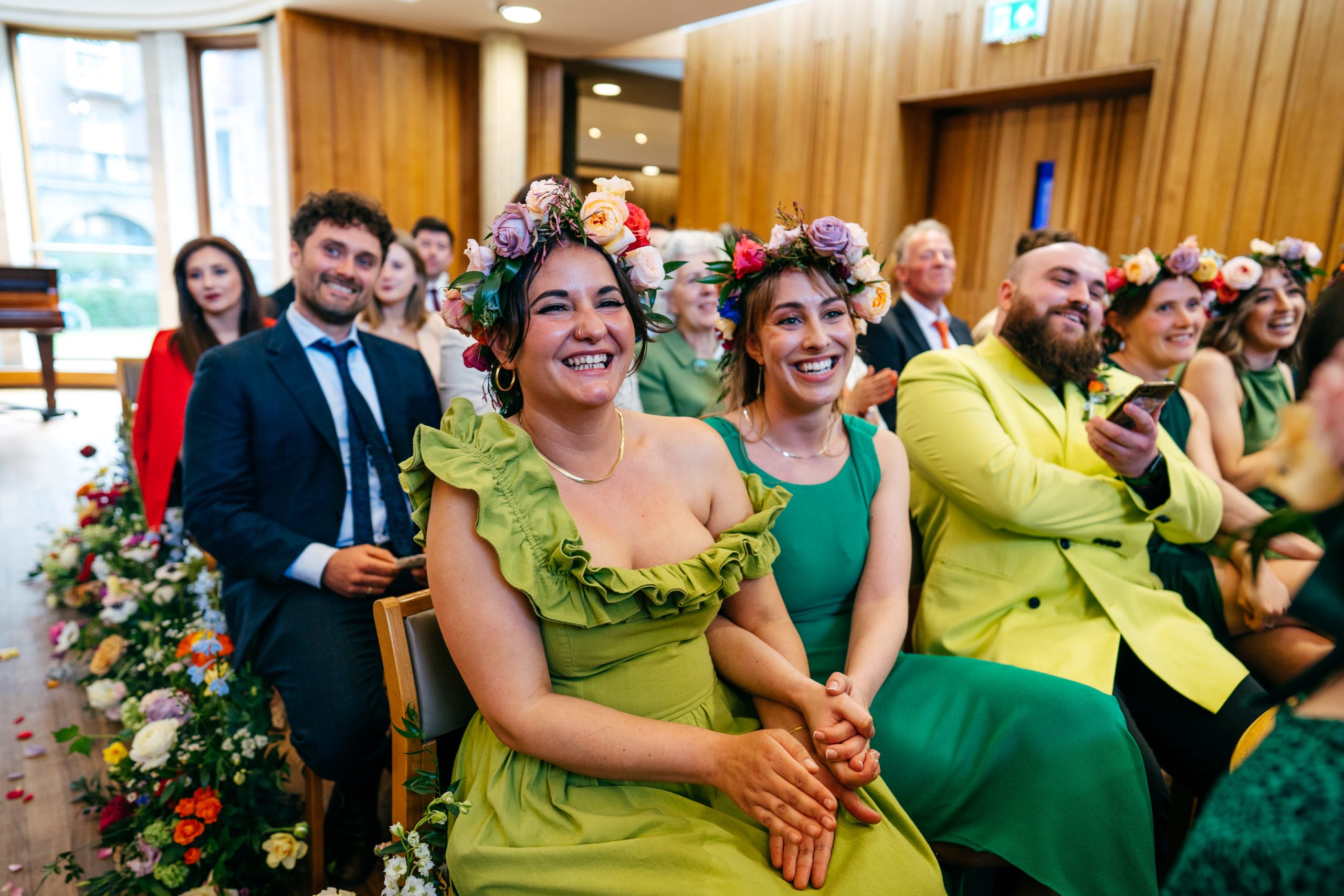 Guests looking super happy during ceremony at Sidney Sussex College Wedding in Cambridge.
